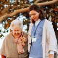 aide taking care of the senior woman
