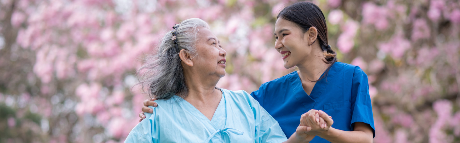 aide smiling at the senior woman