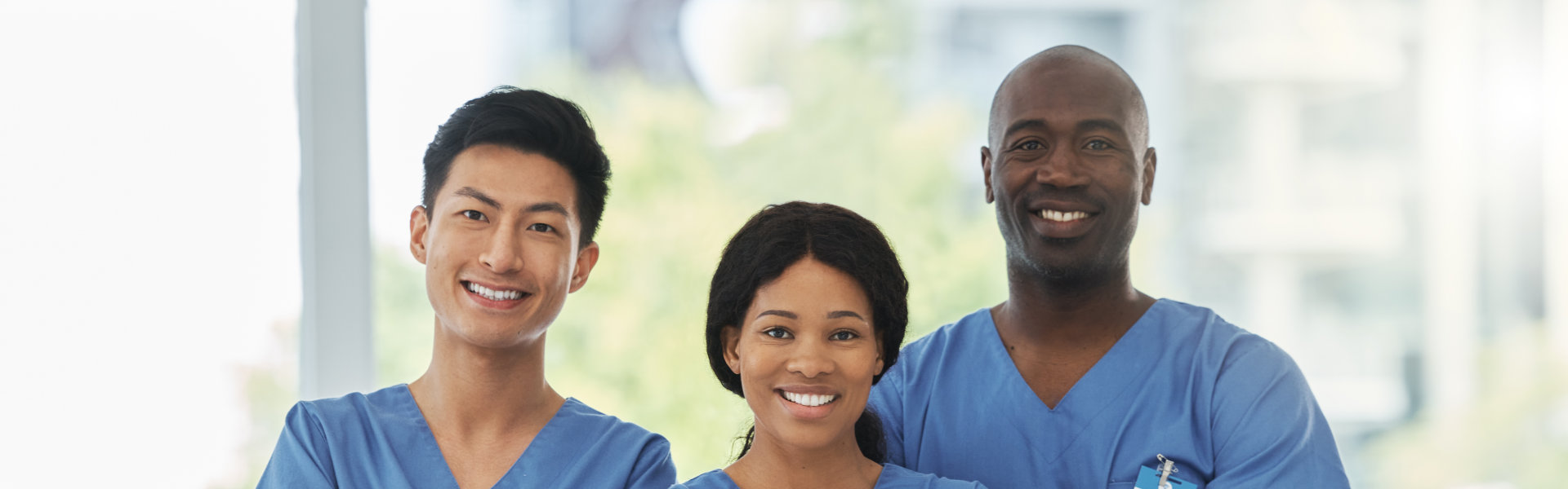 three caregiver smiling together